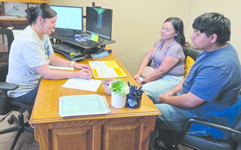Frank Phillips College, Allen Campus held an open house on Monday evening. Visitors met campus staff, toured the campus, met with advisors, and got help with applications for admission and financial aid forms. Pictured reviewing some campus documents are, from left, academic coordinator Monica Hernandez, Bianna Ontiveros, and Aiden Ontiveros.