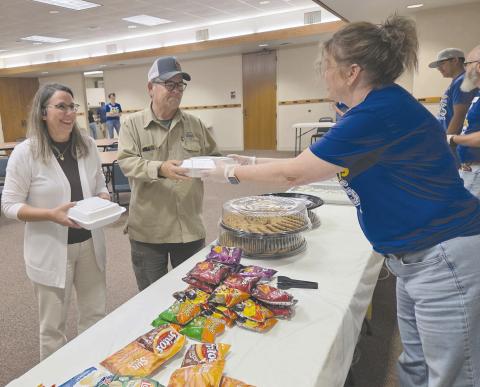 Frank Phillips College, Allen Campus hosted a pulled pork dinner fundraiser Tuesday evening for the Perryton Pathways scholarship program. Hungry diners had dine in, take out, and delivery options available, as well as a silent auction. Pictured are Phil and Lori Dollar picking up their meal from volunteer Misty Stockton. Pathways is open to PHS freshmen and eligible sophomores, juniors, and seniors.