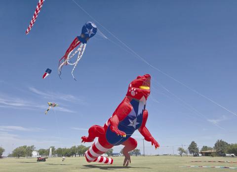 GIANT DINOSAURS IN THE PARK— Perryton saw a gigantic celebration on July 4 at Leatherman Park. In addition to a car show, farmers market, multiple contests and concerts, food trucks, and fireworks, Kites in the Field over Texas brought the spectacle to the celebration with gigantic inflatable kites, including this tremendous floating dinosaur.