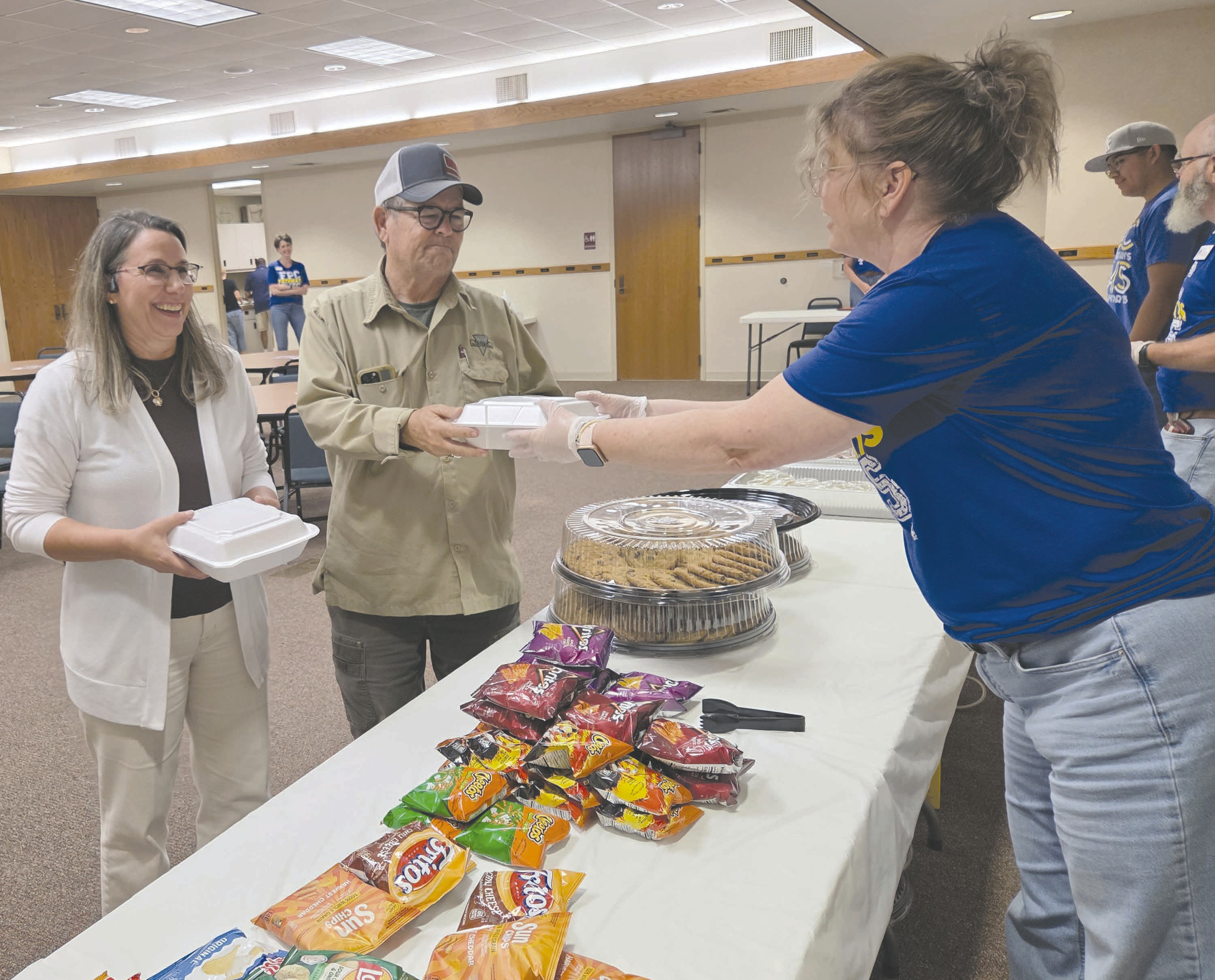 Frank Phillips College, Allen Campus hosted a pulled pork dinner fundraiser Tuesday evening for the Perryton Pathways scholarship program. Hungry diners had dine in, take out, and delivery options available, as well as a silent auction. Pictured are Phil and Lori Dollar picking up their meal from volunteer Misty Stockton. Pathways is open to PHS freshmen and eligible sophomores, juniors, and seniors.