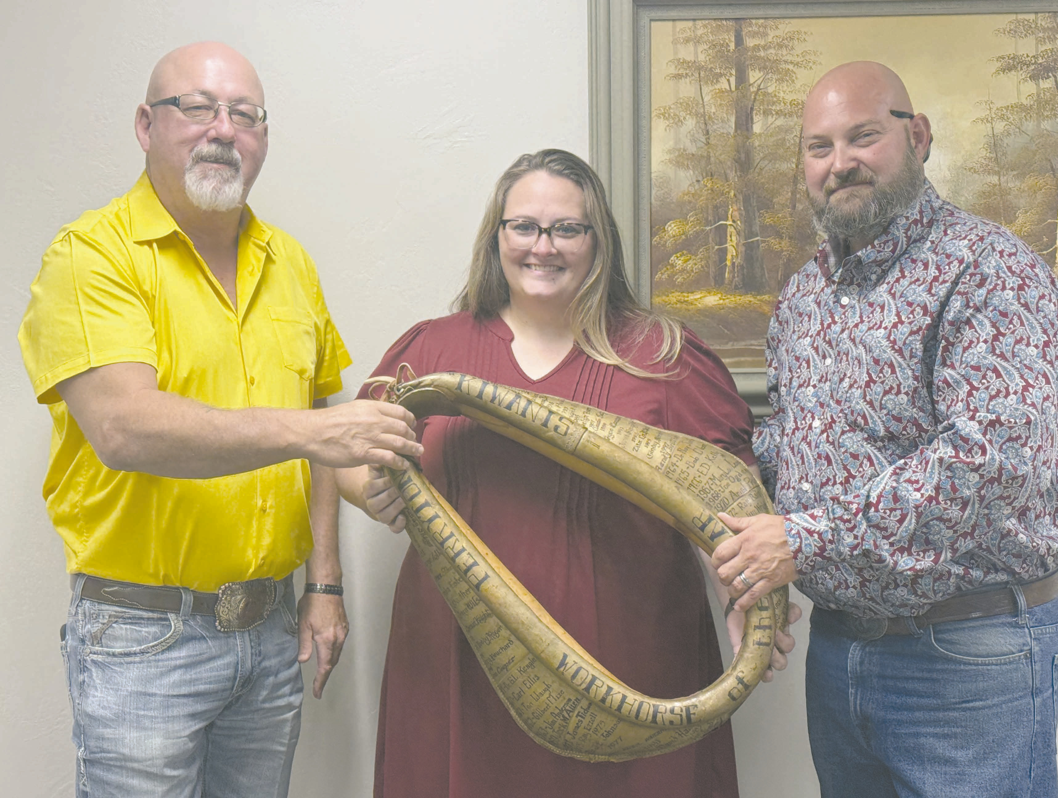 WORKHORSE OF THE YEAR The Perryton Kiwanis Club named Tosha Allison as their Workhorse of the Year on Tuesday evening. She is the coordinator for Toys for Tots, serves on the Wolf Creek Advisory Board, and volunteers with OGH Hospice. Pictured are, from left, presenter Ron Snyder, Tosha Allison, and Kiwanis president Chase