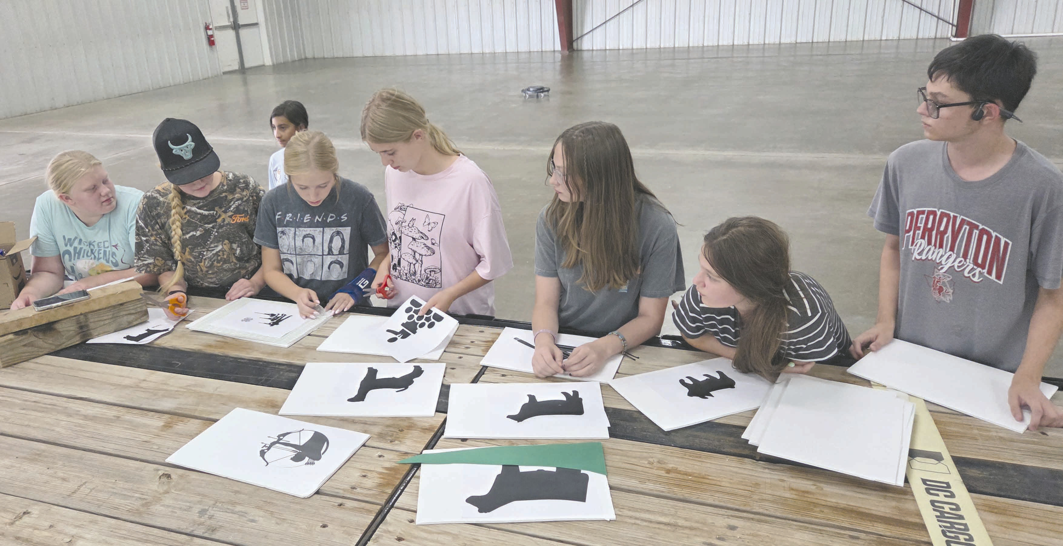 Many organizations and businesses are hard at work preparing their floats for Saturday’s Wheatheart of the Nation Celebration parade, which will march down Main Street starting at 10 a.m. Pictured making plans for decorations for the Ochiltree County 4-H float are, from left, Rebekah Young, Hannah Young, Eden Salazar (in the background), Emmalee Lopez, Darlee George, Kylee Knox, Kaylynn Tarango, and Lou Tarango.