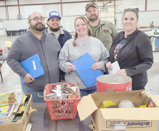 The Perryton Kiwanis Club held its 40th annual auction fund-raiser on Saturday, April 16, at the Ochiltree County Expo Center. This year’s auction included cars, pickups, trucks, trailers, boats, campers, motorcycles, workshop equipment, furniture, tool sets, welders, food baskets, gift certificates, and much more. Pictured organizing donations prior to the auction are, from left, front row, Ralph Gonzalez, Samantha Gonzalez, and Nikki Green; and back row, Daniel Chavira and Chase Allison.