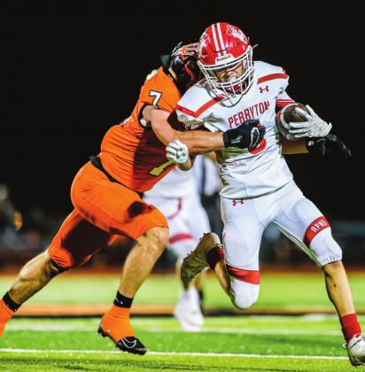 AWAY HE GOES – Junior Cuyler Feger tries to shake off a Demon Friday night, but is brought down for a short gain. The Rangers fell to Dumas, 30-0. (Photo by David Erickson)