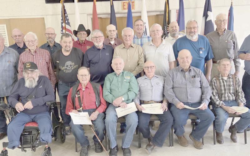 DAR HONORS VIETNAM VETS—The Wolf Creek Chapter of the National Society Daughters of the American Revolution commemorated National Vietnam War Veterans Day on March 29 by recognizing and honoring local veterans of the Vietnam War during their regular meeting in March. Pictured are, from left, front row: Danny Cash, Neal Davis, Byerl Bates, Stan Luck, Bobby Kile, and Dale Herring; second row: Randy Redmon, Senn Slemmons, Richard Cornelius, Keith Whitely, Doug McGarraugh, Merle Davis, and Freddy Bohannon;