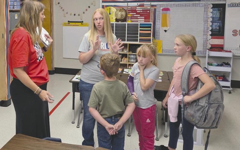 As Perryton Independent School District welcomed students back for another year at school on Wednesday, teachers and staff used the first half of the week to make final preparations for the year and to hold “Meet the Teacher” events to students and parents could get to know their new teachers one-on-one. Pictured at the Meet the Teacher event at Wright Elementary on Monday are, from left, first grade teacher Marci Kirklin, Melissa Meyer, Marshall Meyer, age 6, Madison Meyer, 9, and McKenzie Meyer, 11.