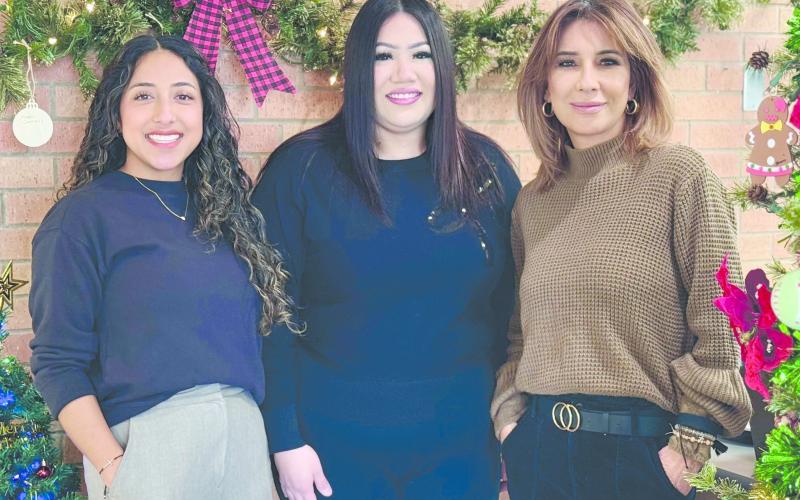 The City of Perryton has once again set up a Giving Garland this year in City Hall to assist local citizens who have difficulty paying their winter heating bills. Anyone can make anonymous donations to help pay utility bills. Pictured with the garland are, from left, city employees Sandra Sosa, Ammie Esquivel, and Laura Rivera.