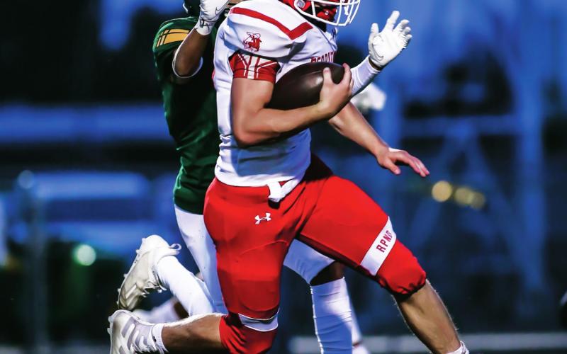 GREAT SHOW FROM THE RANGERS Brenton Heeter (#16, senior) jukes a defender as he barrelled his way to the end zone during the first quarter against the Pampa Harvesters. The Rangers shined but ultimately fell to Pampa 41-35 after two weeks off. See story for more information. (Photo by David Erickson)