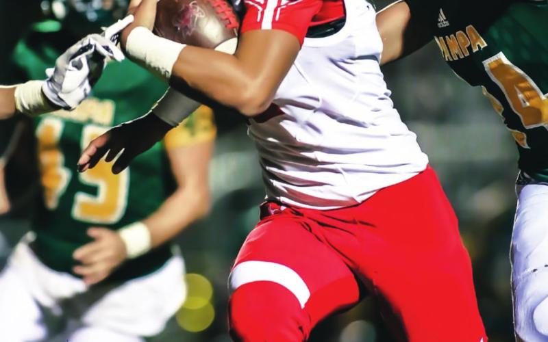 STELLAR SHOWING – The Rangers faced the Pampa Harvester in Pampa Friday, falling 41-35 but bringing their A-game after two weeks off due to COVID quarantines. Above, Pepper Haley (#4, junior) adds yardage to his huge night; at right, Abraham Hernandez (#12, junior) guides a blocker on his way to scoring a touchdown in the 3rd quarter against Pampa. The next game sees the Rangers face Alpine in Sundown. See related story for more information. (Photos by David Erickson)