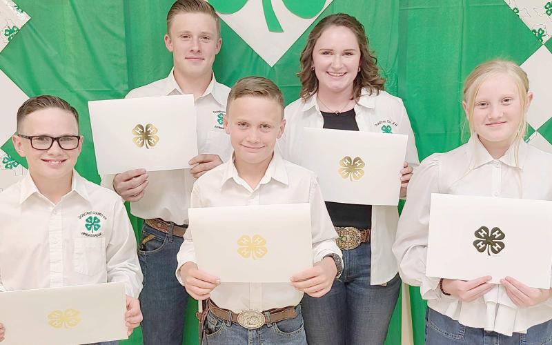 150 POINT AWARDS— Ochiltree County 4-H held their annual awards ceremony Monday night at the Expo Center. Members who accumulated 150 points or more received a certificate and the Donnie Pshigoda Points Scholarship, a $75 scholarship, sponsored by the Ochiltree County Soil and Water Conservation District in honor of Donnie Pshigoda. Pictured are, from left, front row, Clay Oquin, Brady Oquin, and Hannah Young; and back row, Kyle Oquin and Rylan Oquin.