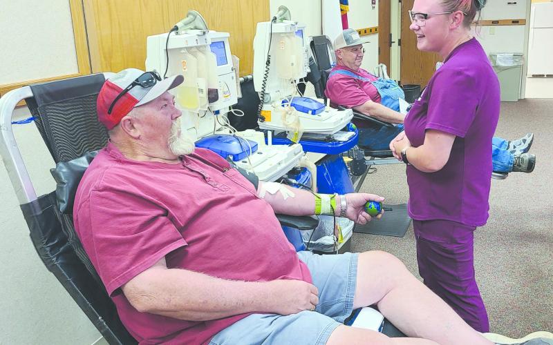 Coffee Memorial Blood Center in Amarillo held a blood drive on Tuesday afternoon at Frank Phillips College, Allen Campus. The drive had a goal of 19 donations, but only had a total of 12 successful donations. Pictured are, from left, Andy Anderson, who is working toward his own goal of donating nine gallons of blood, phlebotomist Ashley Norman, and in back, Sid Tanner.