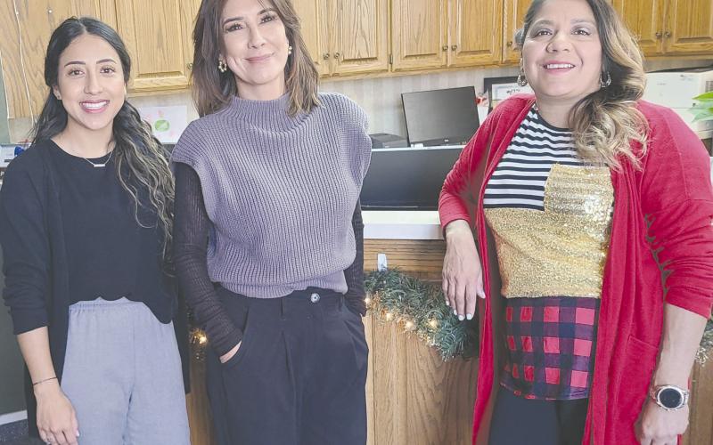 GARLANDS OF GIVING The City of Perryton has once again set up a Giving Garland this year instead of the traditional Giving Tree in City Hall to assist local citizens who have difficulty paying their winter heating bills. Anyone can make anonymous donations to help pay utility bills. Pictured with the garland are, from left, city employees Sandra Sosa, Laura Rivera, and Patty Martinez.
