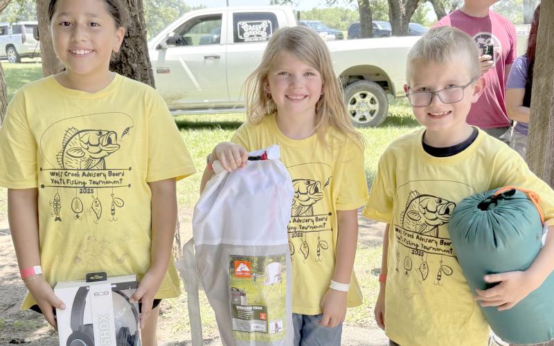 Enthusiastic young fishing fans came out for the Children’s Fishing Tournament at Lake Fryer and Wolf Creek Park at the beginning of June. Pictured are, from left, the top winners in the category for kids ages 7-10, Juliana Becerril (first place), Kinzie Anderson (second place), and Levi Nelson (third place).
