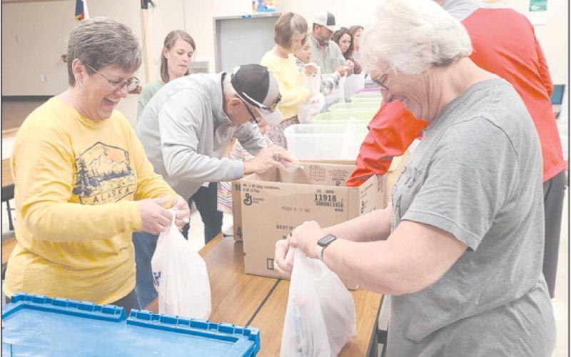 VOLUNTEERS COMING TOGETHER