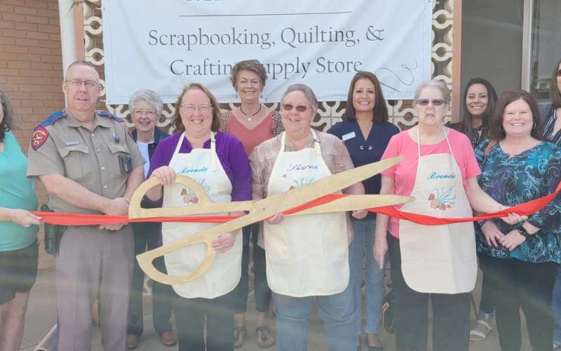 RIBBON CUTTING FOR PAPER AND CLOTH MEMORIES—Perryton-Ochiltree Chamber of Commerce members gathered Tuesday afternoon for a ribbon-cutting ceremony to commemorate the grand opening of Paper and Cloth Memories at 218 SW 3rd Avenue in Perryton. The crafting, quilting, and scrapbooking supply store is owned by Sharon Jenkins and Brenda Austin.