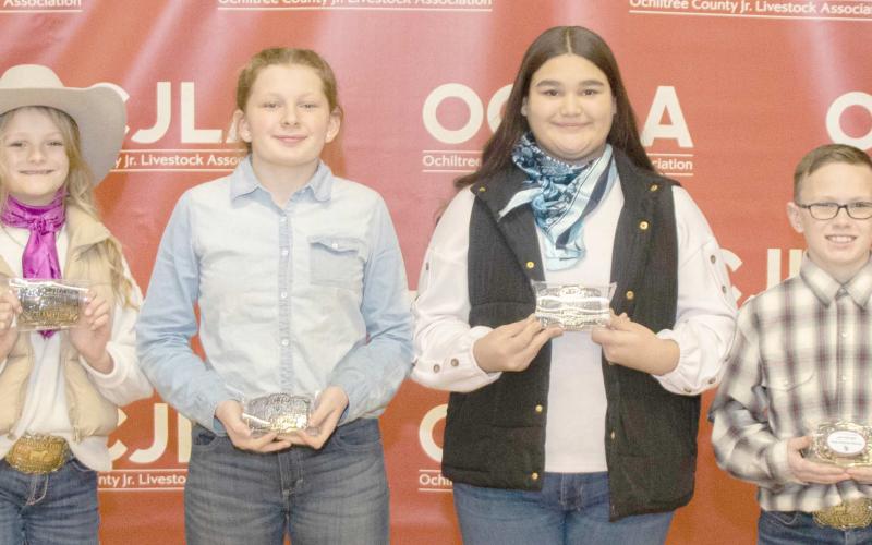 JUNIOR CHAMPION SHOWMANSHIP WINNERS—At the Ochiltree County Junior Livestock Show and Sale, the Junior Champion Showmanship Awards were presented to participating students. Pictured are, from left: Sydney Schickedanz, Addilynn Reihm, Saraelee Pshigoda, and Clay Oquin. (Photo credit: Tessa Powell)