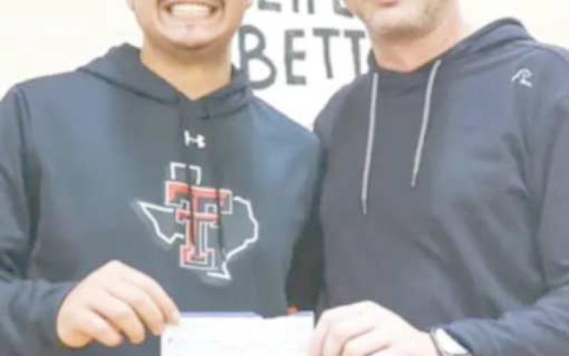 BIG WINNER—Zach Valdez, left, was the big winner in a half-court shot contest sponsored by Perryton Realty during the Ranger and Rangerette basketball games.. He pocketed $500 for making the impressive shot on Feb. 6. To encourage students’ attendance at games, raffle tickets were given to all students attending. If their ticket was drawn, they had a shot at the big prize. Pictured with him is Perryton Realty owner Bryce Hale.
