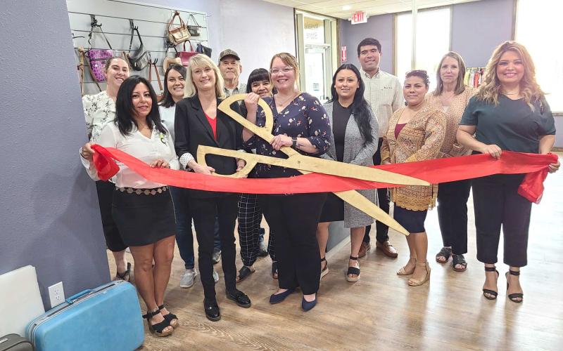 RIBBON-CUTTING HELD AT RESALE STORE – Members of the Perryton-Ochiltree Chamber of Commerce, along with staff, board members, and other well-wishers were on hand on July 22 for a ribboncutting ceremony for the Panhandle Crisis Center’s Resale Store at 301 S. Ash in Perryton. The Resale Store, which sells clothing, housewares, and other goods, helps support the Crisis Center’s projects and services.