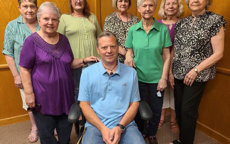 GRAY CLUB DONATES TO JIREH– The Gray Club of Balko, OK donated a new office chair to Jireh Ministries earlier this month to replace furniture lost in the June 2023 tornado. The Gray Club was started in Balko over 70 years ago. They hold an annual pecan fundraiser and use the proceeds to provide scholarships and donate to the Panhandle Crisis Center, the Mutt Hutt, and others. Pictured with Jireh Outreach Ministries Director Jason Vanosdol (front, center) are club members, front row from left, Carolyn Bartel