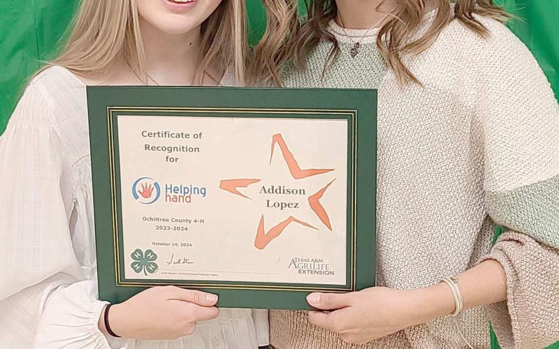 HELPING HAND WINNER—Ochiltree County 4-H held their annual awards ceremony at the Ochiltree County Expo Center on Oct. 14. Addison Lopez was recognized with the Helping Hand Award, which honors a 4-H member who has worked to serve other 4-H members in projects and events. Pictured are, from left, presenter Emmalee Lopez and winner Addison Lopez.