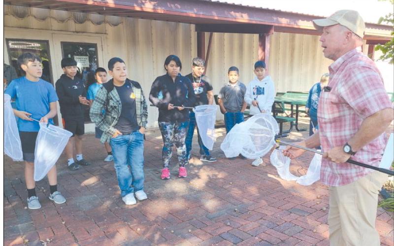 Local students in fourth, fifth, and sixth grades visited the Museum of the Plains on Wednesday to learn about monarch butterflies. In addition to information about butterfly biology, migration, and tourism, students also made butterfly origami, went on a plant scavenger hunt, and watched videos about monarch butterflies. Pictured above, J.W. DeWitt talked to kids about the proper methods to catch, hold, tag, and release monarch butterflies.