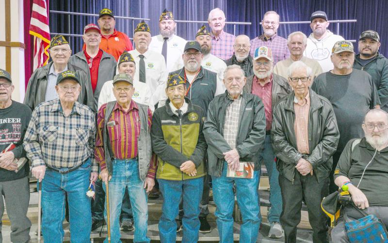Area veterans were honored at Perryton High School’s annual Veterans Day program on Nov. 12. Pictured are, from left, front row, Don Simpson, Robert Mantooth, Neal Davis, Charlie Ludi, Byerl Bates, Don Hulsey, and Robert Overton; second row, Dempsey Malaney, Nikki Green, Dunningan McWhorter, Dr. H.R. Sharp, and Raymond Holt; third row, Mike Richardson, J.W. Hardy, J.W. Brown, Arvel Wall, Doug McGarraugh, and Gerardo Rosales; and back row, Frank Pacheco, Chase Allison, Danny Thurman, Nathan Ellzey, and Ryan