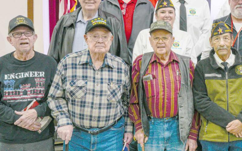 Area veterans were honored at Perryton High School’s annual Veterans Day program on Nov. 12. Pictured are, from left, front row, Don Simpson, Robert Mantooth, Neal Davis, Charlie Ludi, Byerl Bates, Don Hulsey, and Robert Overton; second row, Dempsey Malaney, Nikki Green, Dunningan McWhorter, Dr. H.R. Sharp, and Raymond Holt; third row, Mike Richardson, J.W. Hardy, J.W. Brown, Arvel Wall, Doug McGarraugh, and Gerardo Rosales; and back row, Frank Pacheco, Chase Allison, Danny Thurman, Nathan Ellzey, and Ryan