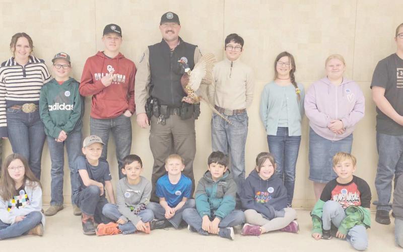ALAMO CLUB GUEST SPEAKER—Game Warden Jeremy Schwalk was the guest speaker for the Alamo 4-H Club. Pictured are first row, from left, Madison Knox, Matt Oquin, Kyren Rodriguez, Dawson Young, Xander Gonzalez, Gracie Love, Jayden George and Clay Oquin; and in back, Kylee Knox, Rylan Oquin, Brady Oquin, Kyle Oquin, Schwalk, Louie Tarango, Kaylynn Tarango, Rebekah Young and Nathan Knox.