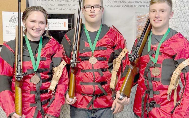 4-H MEMBERS QUALIFY FOR STATE —Ochiltree County 4-H members competed recently at the Panhandle District 4-H Roundup contests in Amarillo, and three qualified for state competition. Pictured are, from left, Rylan Oquin, Nathan Knox, and Kyle Oquin, who placed third overall as a team in the senior division of the .22 Rifle competition and qualified for state. Rylan Oquin also qualified for state in the senior Musical Instrument division of the Talent Contes
