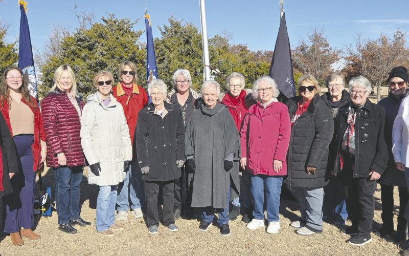 DAR HOLDS WREATHS ACROSS AMERICA EVENT—Ochiltree County once again participated in the nationwide “Wreaths Across America” ceremony at Ochiltree Cemetery. The event is sponsored by the Wolf Creek Chapter of the National Society Daughters of the American Revolution. Pictured are DAR members, from left: Sherrie Rima, Grace Gaertner (who performed the National Anthem) Ruth Ann Noe, Ann Haley, Nan Cook, Cynthia Shattles, Debra Dye, Carol McGarraugh, Barbara Johnson, Kay McGarraugh, Nan Schwalk, Lou Ann Slemmons