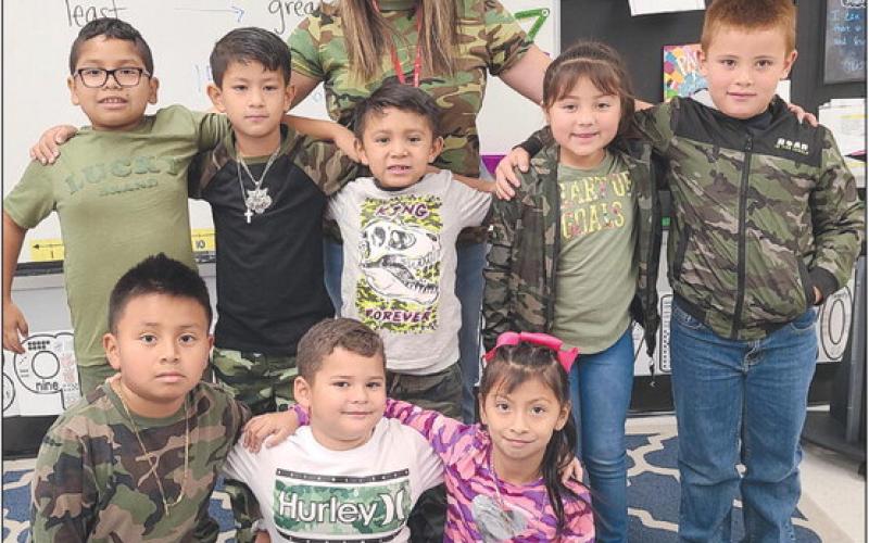 CAMO KIDS Students at Perryton schools had dress-up days during Red Ribbon Week, from Oct. 26-31 to encourage kids to be drug- and bully-free. One Wednesday, students at Wright Elementary School wore camo clothing. Pictured are, from left, front row, Ryan Garcia, Dylan Licon, and Lidia De La Cruz; second row, Emiaj Arreola, Ever Castillo, Alex Becerril, Isabella Camacho, and Luis Medrano; in back is first grade teacher Lucy Cummins.