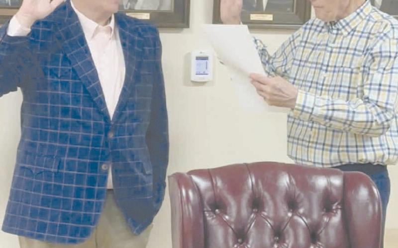 The Ochiltree County Commissioners held a special meeting on Monday to swear in Eric Kerl as the county’s new Justice of the Peace. The previous Justice of the Peace, Bucky Goldsberry, died in March. Since he ran unopposed in the recent primary election, the county and the Republican County Executive Committee appointed Kerl to fill the position through at least Dec. 31 of this year. Pictured are, from left, Kerl and County Judge Charles Kelly.