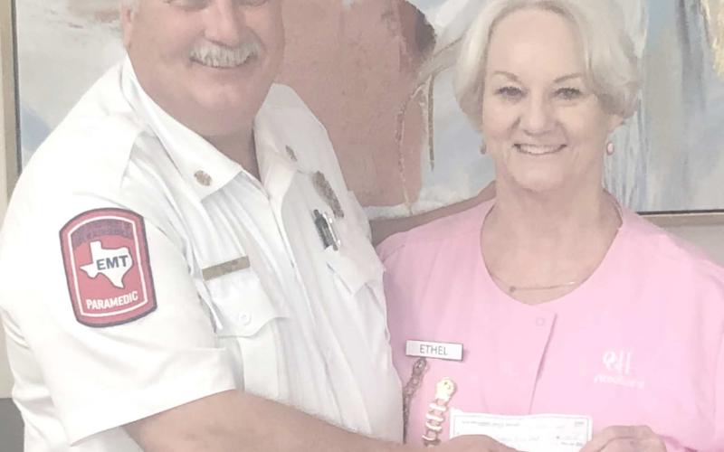 The Ochiltree General Hospital Auxilliary presented a donation of $1,000 to the volunteer fire department during their meeting at the Senior Citizen Center on April 1. Pictured are Perryton Fire Chief Paul Dutcher and Hospital Auxiliary president Ethel Rudd.