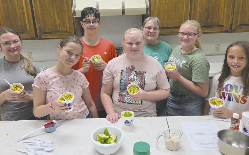 Students participating in Ochiltree County 4-H’s Foods Project got together last Thursday to make elote, or Mexican street corn. Eight of the students taking part in the project will be traveling to District competition in Canyon on Oct. 27. Pictured are, from left, front row: Kaylynn Tarango, Rebekah Young, and Izzy Heck; back row: Kylee Knox, Lou Tarango, project leader Shelley Haller, and Hannah Young