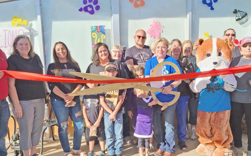 RIBBON CUTTING FOR MUTT HUTT BAKERY— Perryton-Ochiltree Chamber of Commerce members gathered last Friday afternoon for a ribbon-cutting ceremony to commemorate the grand opening of the Mutt Hutt Bakery and Boutique at 212 SW 3rd Street in Perryton. The pet bakery and boutique is owned by Ryan and Audra Wells.
