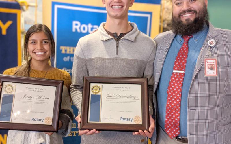 STUDENTS OF THE MONTH—Perryton High School seniors Jocelyn Medina, left, and Jacob Schollenbarger, center, were named the Rotary Club Students of the Month for September. Pictured with them is Dimitri Garcia, student of the month presenter and PJH principal.