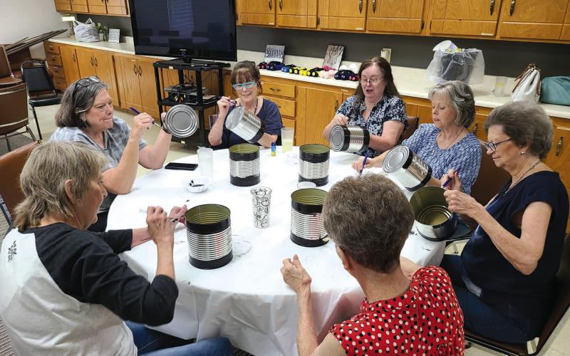 CREATING HOMEMADE DECOR The Ochiltree County Senior Citizens Center held a crafting day on Monday afternoon. Members at the center made tabletop centerpiece decorations and wasp/insect traps. Pictured are, clockwise from bottom right: Nancy Cain, Frances Aston, Penny Clark, Toni Boren, Becky Childers, Charlotte Cape, and Kay Allison.
