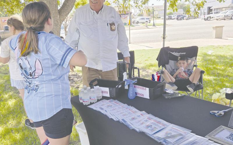 The annual block party, sponsored by the Perryton Ochiltree Chamber of Commerce, brought local residents out last Thursday evening to enjoy snacks and activities at the county courthouse and along downtown Main Street. Ochiltree County Sheriff Terry Bouchard and his staff from the Sheriff’s Office sponsored a booth at the courthouse lawn to distribute kids’ DNA kits, along with fun activity booklets.