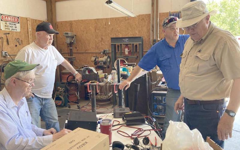NATIONAL FIELD DAY—Members of the Top of Panhandle Amateur Radio Club participated in the AARL National Field Day on June 26. The idea behind the day was to practice communication skills in case of a disaster. Pictured are, from left, Jerome Doerrie, Larry Chancellor, Jim Lear and Dempsey Malaney.
