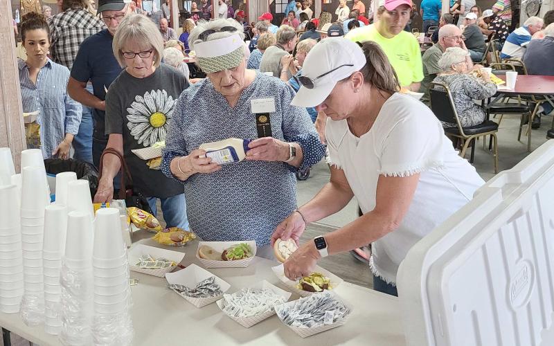 THE CHOW LINE— There was a line all the way through the Museum of the Plains on Saturday for people eager for lunch on hamburgers, hot dogs, and homemade ice cream. The museum’s annual Pioneer Day, part of the Wheatheart of the Nation Celebration, brought hundreds of visitors.