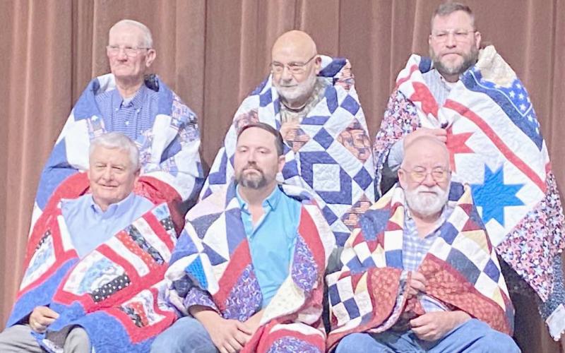QUILTS OF VALOR HONOREES— The second group of veterans presented Quilts of Valor by the Friendship Quilt Guild on Oct. 16 were, first row, from left, Willis Smith, Byron Hoover and Robert Freeman; and second row, Bob Karber, Earl Hill and Jeff Mincy.
