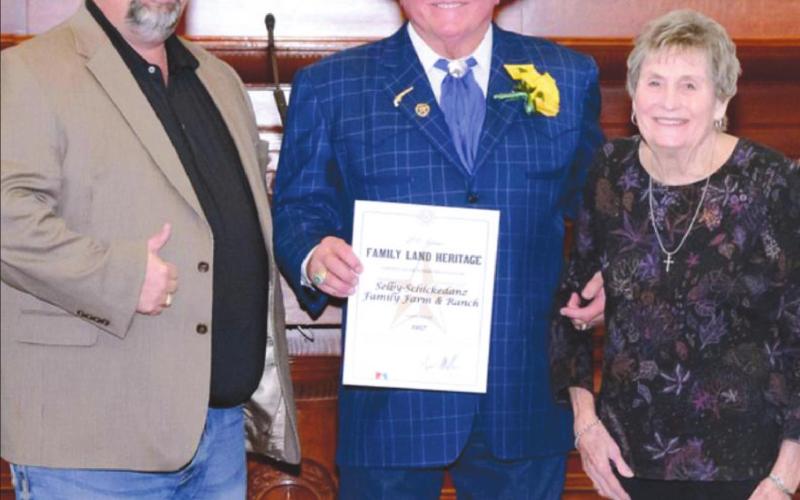 LOCAL FAMILY HONORED Texas Department of Agriculture’s Family Land Heritage Program recently honored Texas farms/ranches that have been in operation more than 100 years. Pictured receiving the honor at the Texas State Capitol on behalf of the Selby-Schickedanz Family Farm &amp;amp; Ranch are Jason Schickedanz (left) and Charleen (Selby) Schickedanz (right) with Texas Agriculture Commissioner Sid Miller (center).