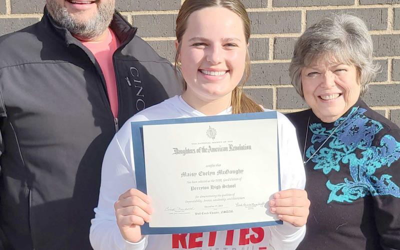 GOOD CITIZENS AWARD— Perryton High School senior Maisy McGaughy, center, has been named the recipient of the DAR Good Citizens $1,,000 scholarship. As the winner, her essay packet advances to state competition. Pictured with her are her father, Sam McGaughy, left, and DAR member Cheryl Bullard.