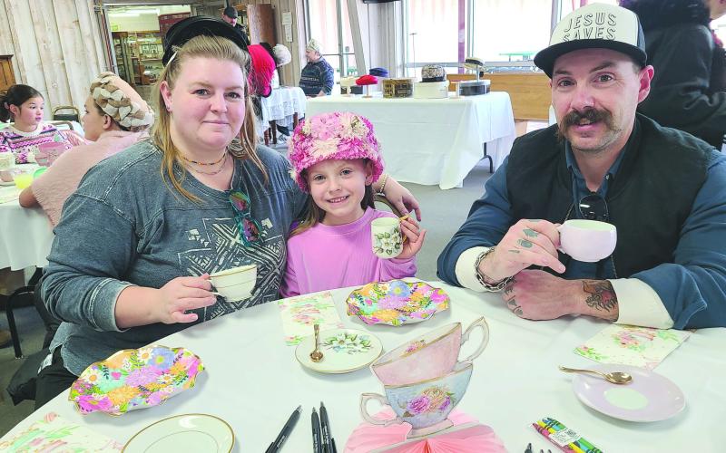 Parents, kids, and grandparents of all ages stopped by the Museum of the Plains on Sunday, Jan. 19, to enjoy an old-fashioned afternoon tea party. Party-goers picked out fancy hats to wear and enjoyed tea, punch, finger sandwiches, cookies, and plenty of good company, as well as checking out the museum’s new display of Doris Wilkens’ children’s tea set collection. Pictured are, from left, Carolyn Thomas, Juliza Thomas, age 6, and Jordan Thomas.