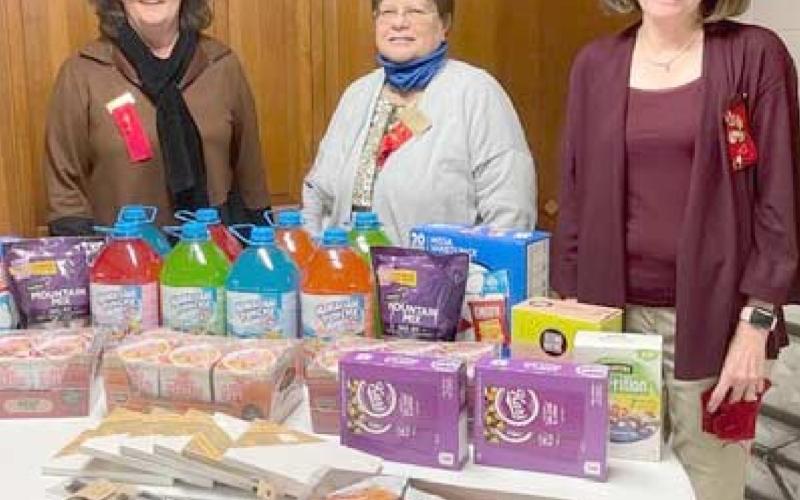 CRISIS CENTER GIFTS—The Eta Alpha chapter of Delta Kappa Gamma purchased snacks and arts and crafts items for the Panhandle Crisis Center as its project. Pictured are, from left, Lana Yeary, Sharon Cummings and Renee Lee.