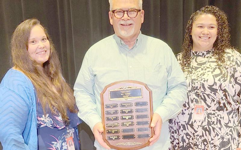 TEACHER OF THE YEAR— This year’s Excellence in Education Award, presented during the annual awards ceremony at Perryton High School on May 1, was presented to PHS choir teacher Keith Harris. Pictured are, from left, PHS principal Tori Little, Harris, and vice principal Francis Zavala.