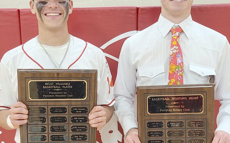 BOYS BASKETBALL AWARDS— Perryton High School’s boys basketball team was honored May 1 at the Perryton High School All Sports Awards Banquet. Pictured are, from left: Julian Cervantes, who brought home the MVP award, and Tad Pshigoda, winner of the Fighting Heart award.