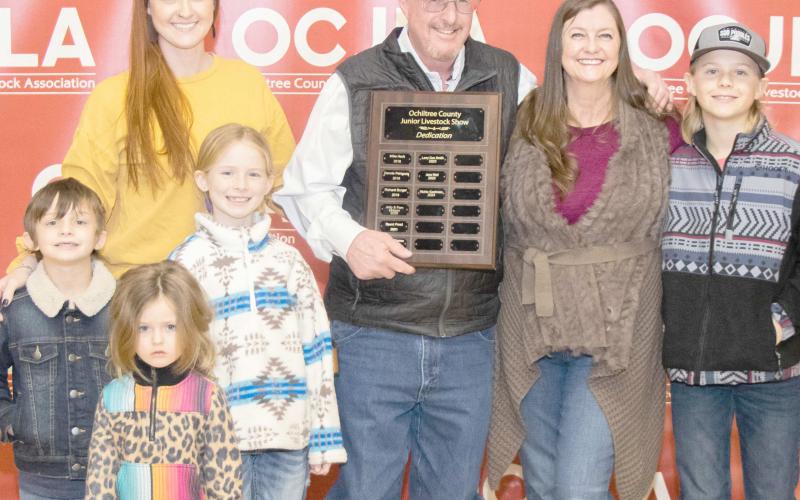 STOCK SHOW DEDICATED TO GASTINEAU— This year’s Ochiltree County Junior Livestock Show and Sale was dedicated to Richie Gastineau. Pictured are, in front, Bridgette Cole; in middle row, from left, Archie Cole and Scarlett Cole; and back row, Britta Cole, Richie Gastineau, Tanya Gastineau, and Silas Cole. ( Photo credit: Tessa Powell)