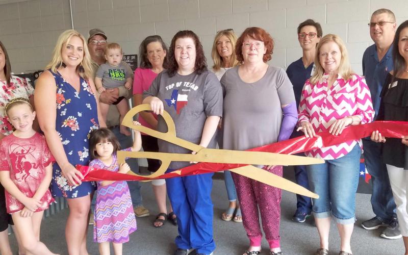 CHAMBER MEMBERS HOLD RIBBON CUTTING