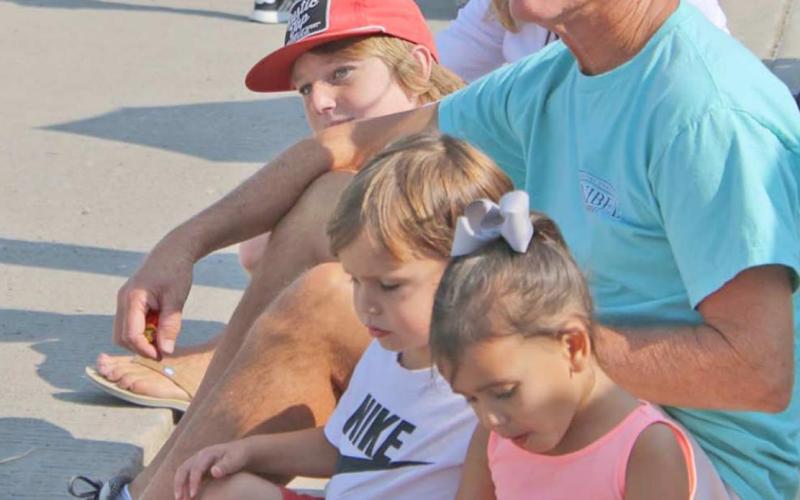 Doug Hale at Wheatheart parade with three of his eight grandchildren